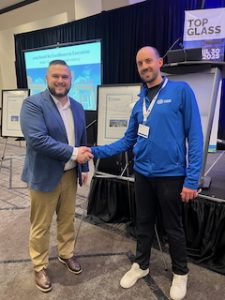 Steve Peso congratulates Robert Maggiacomo from Universal Aluminum on receiving the Award for Excellence in Execution